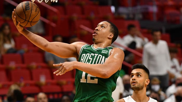 Boston Celtics forward Grant Williams (12) drives to the basket against as Miami Heat center Omer Yurtseven.